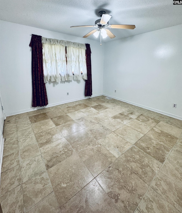 916 Sessions Rd, Elgin, SC 29045 - empty room featuring ceiling fan, a textured ceiling, and baseboards