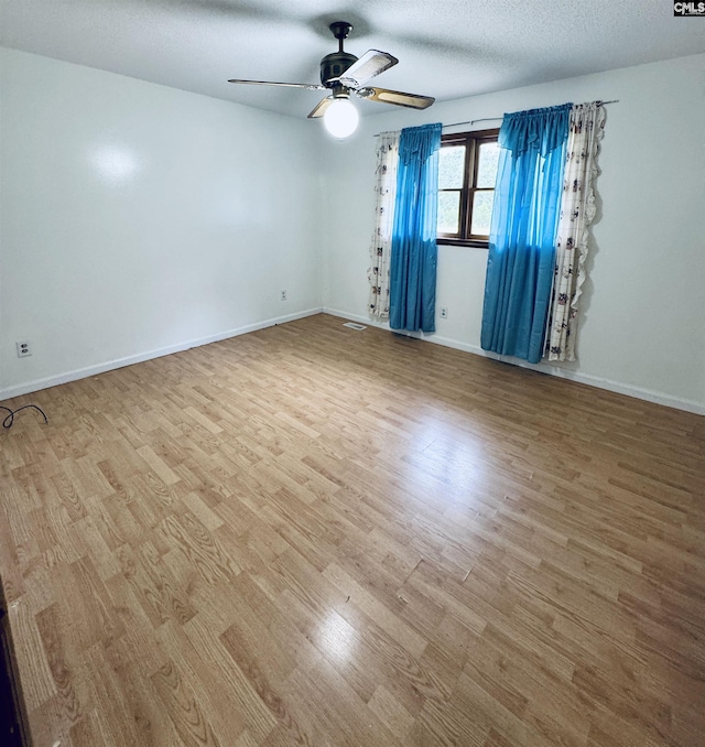 916 Sessions Rd, Elgin, SC 29045 - spare room featuring ceiling fan, wood finished floors, baseboards, and a textured ceiling