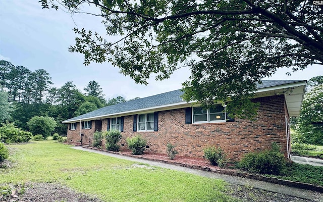 916 Sessions Rd, Elgin, SC 29045 - ranch-style house with a front lawn, brick siding, crawl space, and roof with shingles