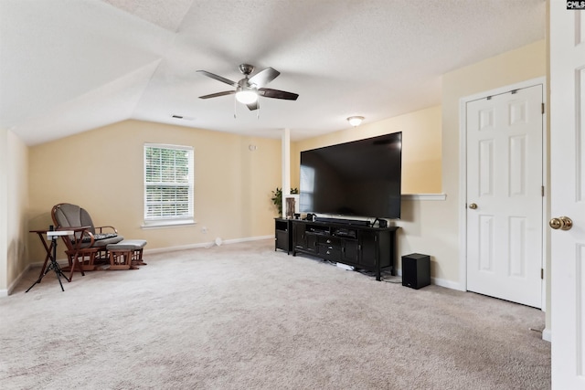 209 Walden Place Cir, Elgin, SC 29045 - living area with ceiling fan, light carpet, baseboards, lofted ceiling, and a textured ceiling