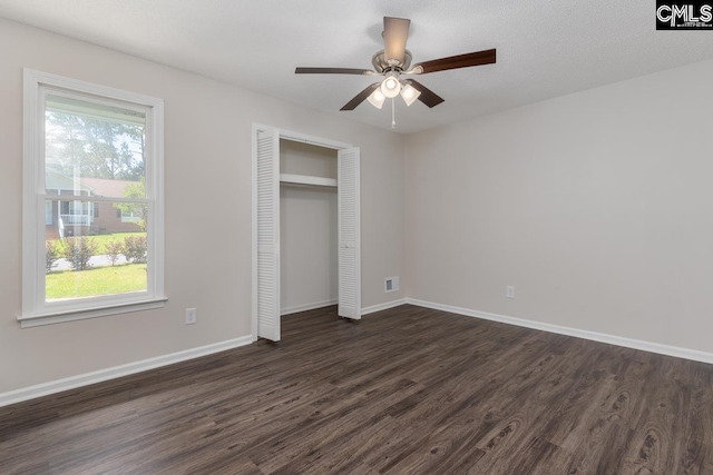 2308 Exton Shore Dr, Columbia, SC 29209 - unfurnished bedroom with dark wood-style flooring, baseboards, a closet, and a ceiling fan