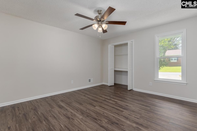 2308 Exton Shore Dr, Columbia, SC 29209 - unfurnished bedroom featuring dark wood-style floors, baseboards, a closet, a textured ceiling, and ceiling fan