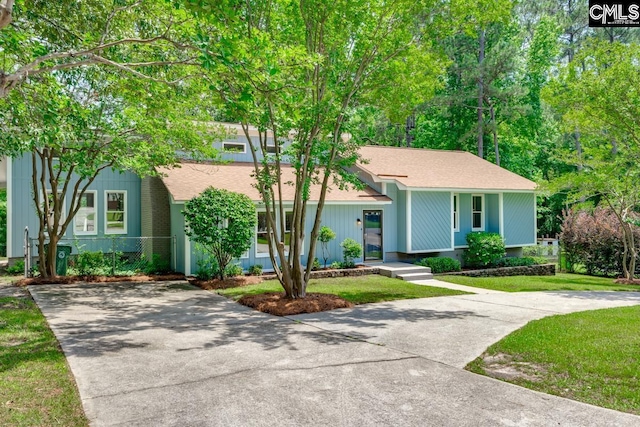 2308 Exton Shore Dr, Columbia, SC 29209 - view of front of house with driveway, a front yard, and roof with shingles