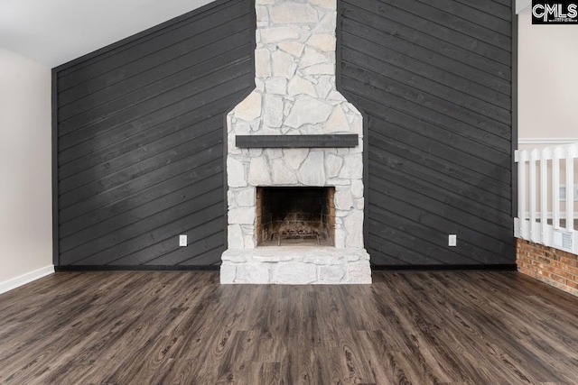 2308 Exton Shore Dr, Columbia, SC 29209 - unfurnished living room with wood finished floors, baseboards, and a stone fireplace