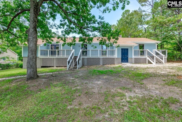 2308 Exton Shore Dr, Columbia, SC 29209 - view of front facade featuring stairs, a shingled roof, and a wooden deck