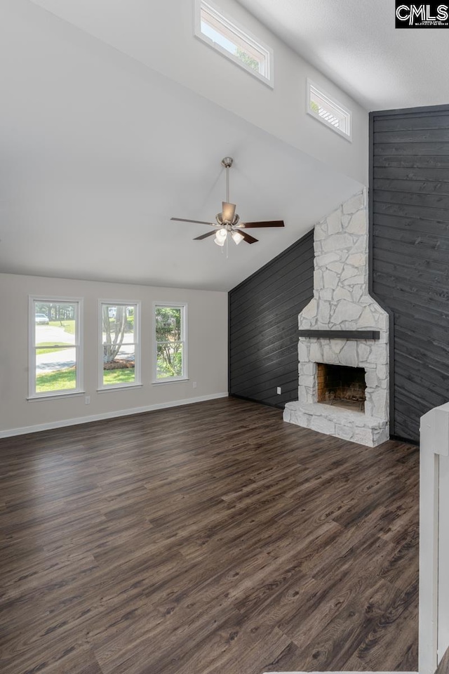 2308 Exton Shore Dr, Columbia, SC 29209 - unfurnished living room with ceiling fan, a stone fireplace, baseboards, dark wood-style flooring, and a towering ceiling