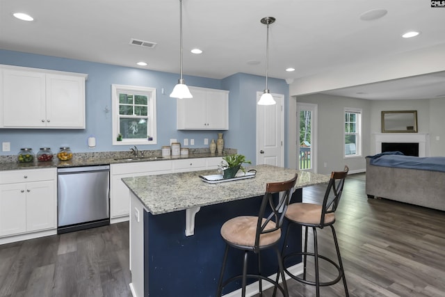 53 Findlay Cir, Elgin, SC 29045 - kitchen featuring stainless steel dishwasher, a sink, open floor plan, dark wood-style floors, and recessed lighting
