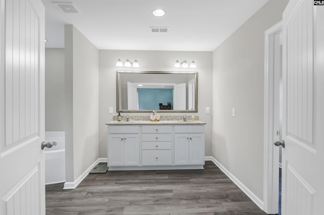 53 Findlay Cir, Elgin, SC 29045 - full bath with double vanity, wood finished floors, baseboards, and recessed lighting