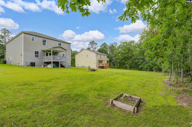 53 Findlay Cir, Elgin, SC 29045 - view of grassy yard featuring a deck, a vegetable garden, and cooling unit