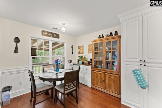612 Williams Cir, West Columbia, SC 29172 - dining area featuring dark wood-style floors and a wainscoted wall