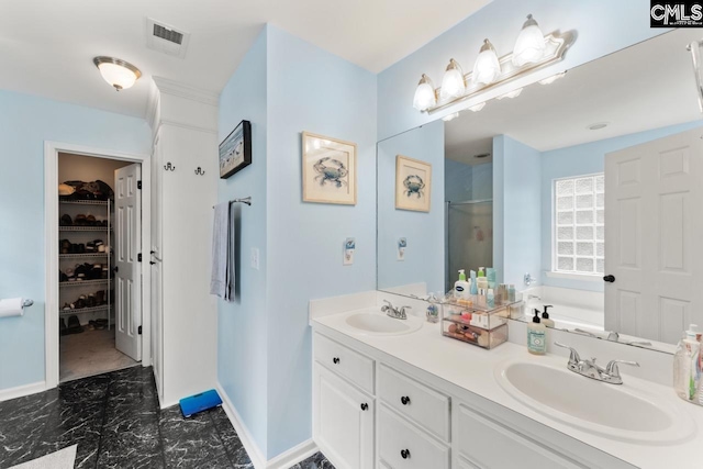612 Williams Cir, West Columbia, SC 29172 - bathroom with a stall shower, a garden tub, double vanity, baseboards, and a walk in closet
