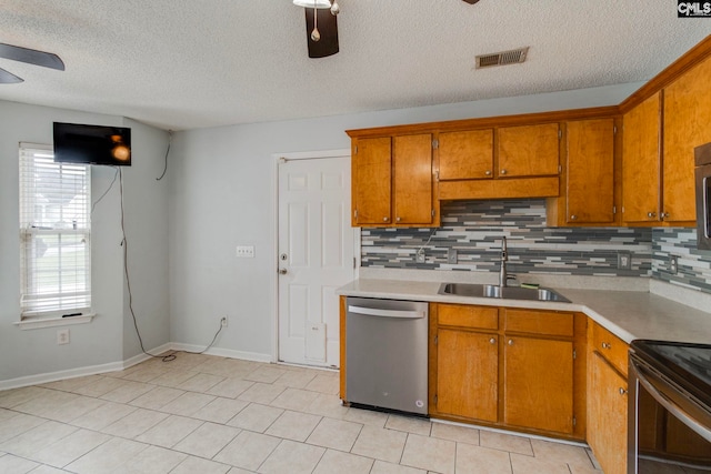 11 Parkhaven Ct, Columbia, SC 29209 - kitchen featuring dishwasher, a sink, a ceiling fan, brown cabinets, and a textured ceiling