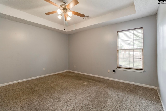 11 Parkhaven Ct, Columbia, SC 29209 - carpeted empty room with a tray ceiling, a ceiling fan, and baseboards