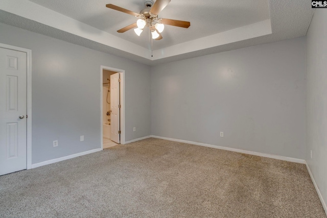11 Parkhaven Ct, Columbia, SC 29209 - empty room with a raised ceiling, a ceiling fan, light colored carpet, and baseboards