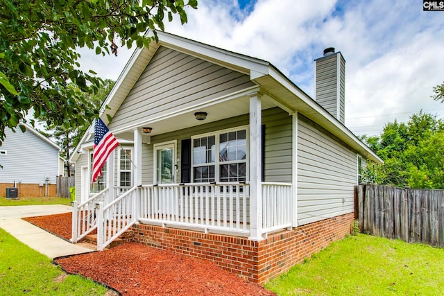 11 Parkhaven Ct, Columbia, SC 29209 - shotgun-style home featuring a porch and a chimney
