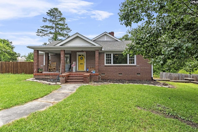 303 N Rudolph St, Saluda, SC 29138 - bungalow-style home featuring crawl space, covered porch, brick siding, and a shingled roof
