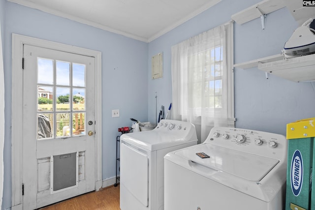 303 N Rudolph St, Saluda, SC 29138 - laundry area with separate washer and dryer, ornamental molding, healthy amount of natural light, and light wood-style flooring