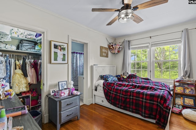 303 N Rudolph St, Saluda, SC 29138 - bedroom with wood finished floors, ornamental molding, a closet, and a ceiling fan