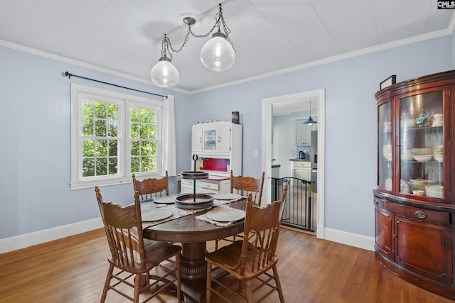303 N Rudolph St, Saluda, SC 29138 - dining room featuring hardwood / wood-style floors, baseboards, and ornamental molding