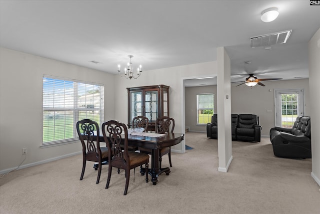 175 Rosecliff Cir, Hopkins, SC 29061 - dining space with light carpet, a chandelier, baseboards, and a ceiling fan