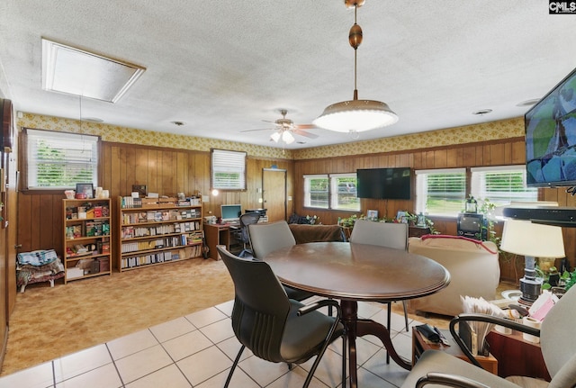 2015 Valley View Rd, West Columbia, SC 29172 - dining space with light carpet, attic access, wallpapered walls, light tile patterned floors, and wood walls