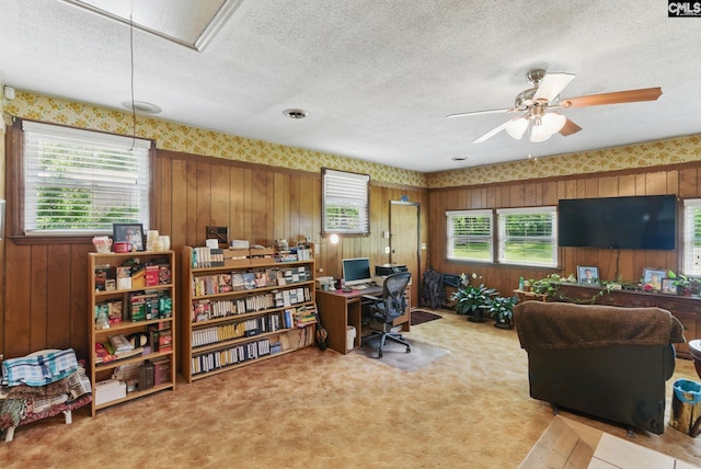 2015 Valley View Rd, West Columbia, SC 29172 - carpeted office with attic access, a ceiling fan, wood walls, a textured ceiling, and wallpapered walls