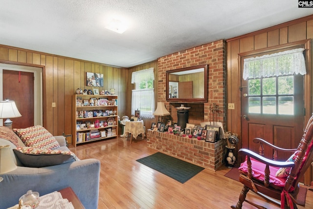 2015 Valley View Rd, West Columbia, SC 29172 - living area featuring plenty of natural light, wood finished floors, wood walls, and a textured ceiling
