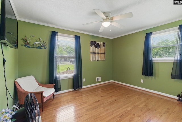 2015 Valley View Rd, West Columbia, SC 29172 - living area with light wood-style flooring, ceiling fan, ornamental molding, and baseboards