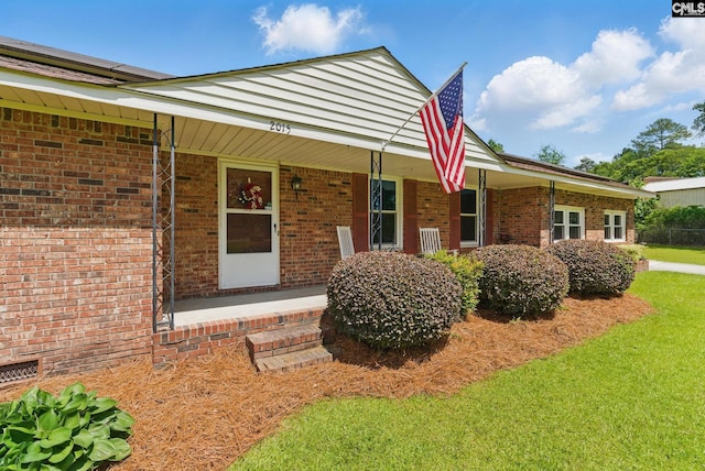 2015 Valley View Rd, West Columbia, SC 29172 - view of front of property featuring a porch, brick siding, and a front lawn