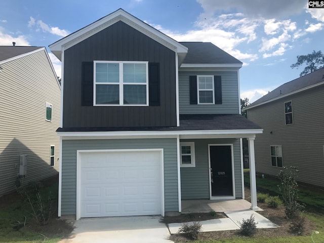 1069 Roscoe Rd, Lexington, SC 29073 - view of front of house featuring an attached garage, a porch, and board and batten siding