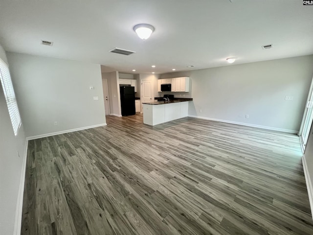 1069 Roscoe Rd, Lexington, SC 29073 - unfurnished living room featuring wood finished floors, baseboards, and recessed lighting