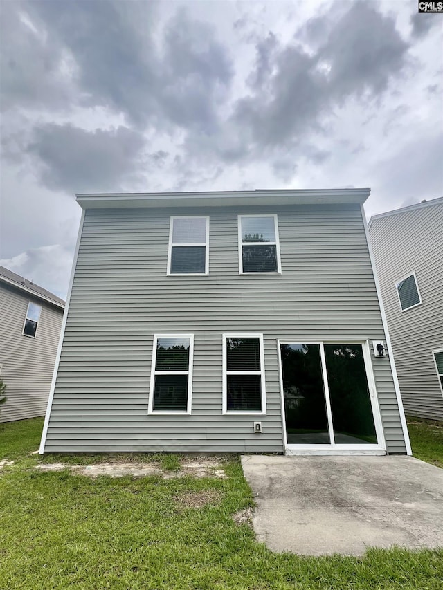 1069 Roscoe Rd, Lexington, SC 29073 - rear view of house with a patio and a lawn