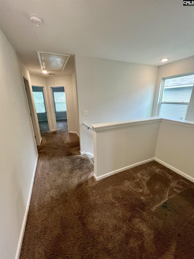 1069 Roscoe Rd, Lexington, SC 29073 - hallway with attic access, dark colored carpet, and baseboards