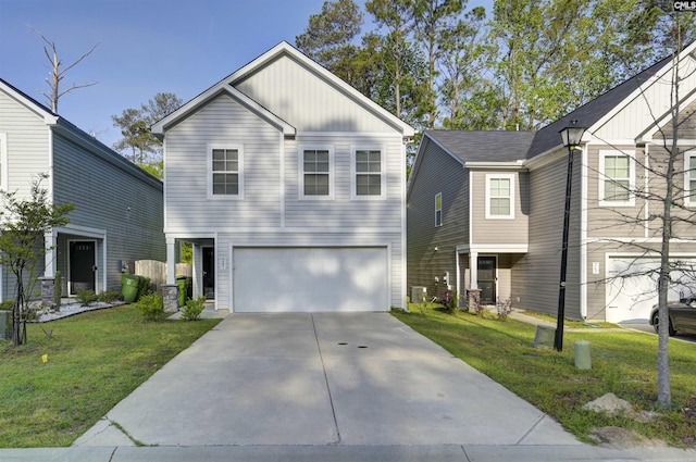 341 Liliana Dr, Columbia, SC 29223 - view of front of house featuring an attached garage, driveway, a front lawn, and board and batten siding