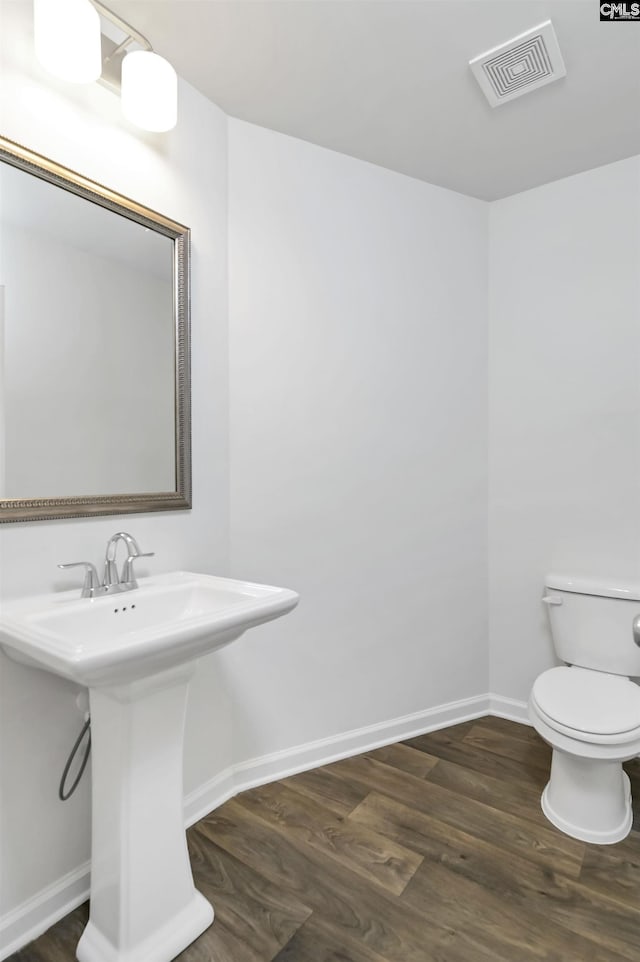 341 Liliana Dr, Columbia, SC 29223 - bathroom with a sink, toilet, wood finished floors, and baseboards