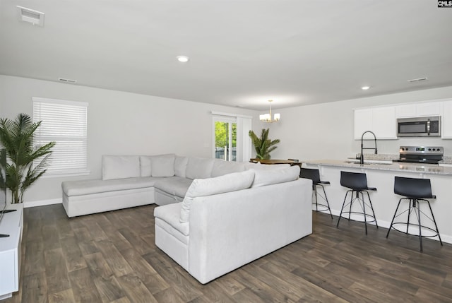 341 Liliana Dr, Columbia, SC 29223 - living room featuring a chandelier, dark wood-style flooring, recessed lighting, and baseboards