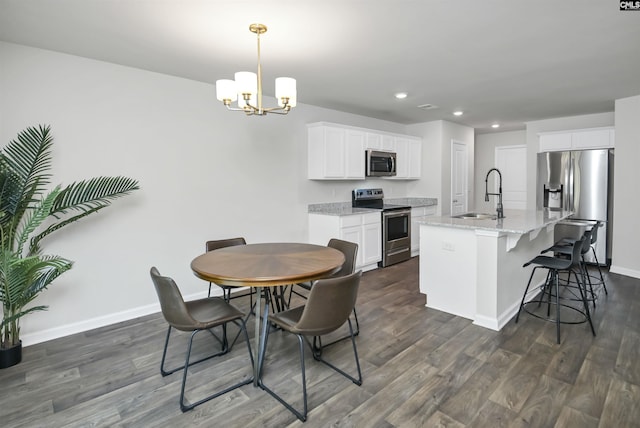 341 Liliana Dr, Columbia, SC 29223 - dining space with recessed lighting, baseboards, a chandelier, and dark wood-style floors