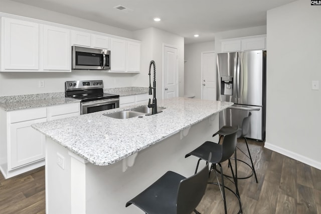 341 Liliana Dr, Columbia, SC 29223 - kitchen with appliances with stainless steel finishes, a sink, recessed lighting, dark wood-type flooring, and white cabinets