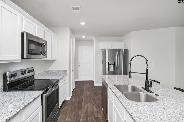 341 Liliana Dr, Columbia, SC 29223 - kitchen featuring appliances with stainless steel finishes, a sink, dark wood finished floors, recessed lighting, and white cabinets