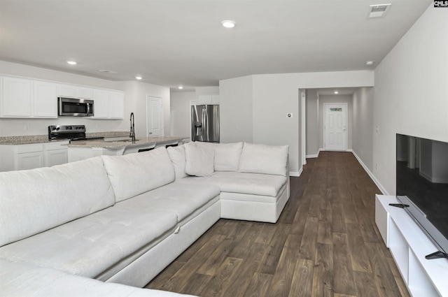 341 Liliana Dr, Columbia, SC 29223 - living area with dark wood-style flooring, recessed lighting, and baseboards