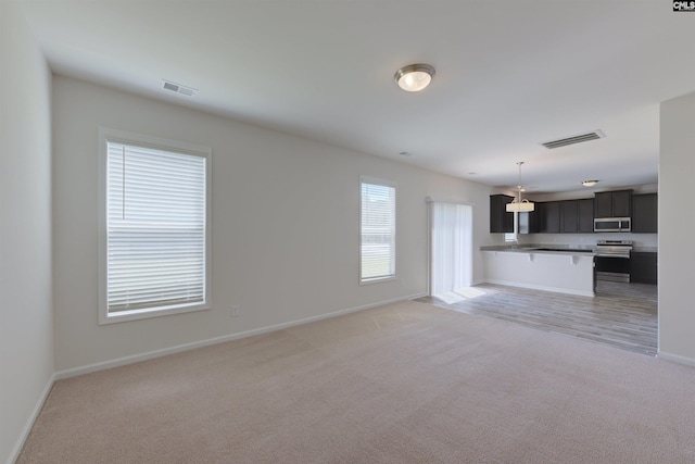 812 Poplar Bend Rd, Columbia, SC 29229 - unfurnished living room featuring light carpet and baseboards