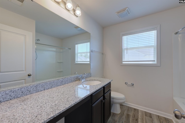 812 Poplar Bend Rd, Columbia, SC 29229 - full bath featuring toilet, vanity, wood finished floors, baseboards, and shower / washtub combination