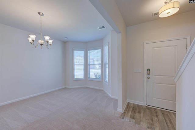 812 Poplar Bend Rd, Columbia, SC 29229 - carpeted foyer featuring baseboards and a chandelier