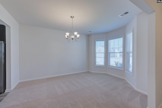 812 Poplar Bend Rd, Columbia, SC 29229 - unfurnished room featuring light carpet, a chandelier, baseboards, and arched walkways