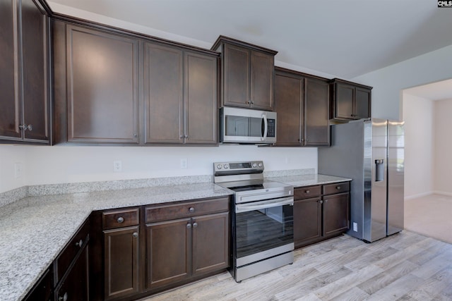 812 Poplar Bend Rd, Columbia, SC 29229 - kitchen featuring appliances with stainless steel finishes, dark brown cabinetry, light wood finished floors, and light stone counters