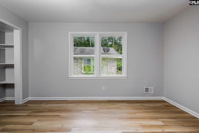 198 Stanford St, Columbia, SC 29203 - unfurnished bedroom with wood finished floors, baseboards, and a closet
