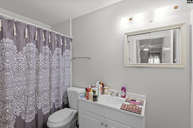1208 Bush River Rd Unit G10, Columbia, SC 29210 - bathroom with a textured ceiling, vanity, toilet, and curtained shower