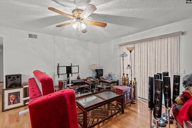 1208 Bush River Rd Unit G10, Columbia, SC 29210 - home office with a textured ceiling, wood finished floors, and a ceiling fan