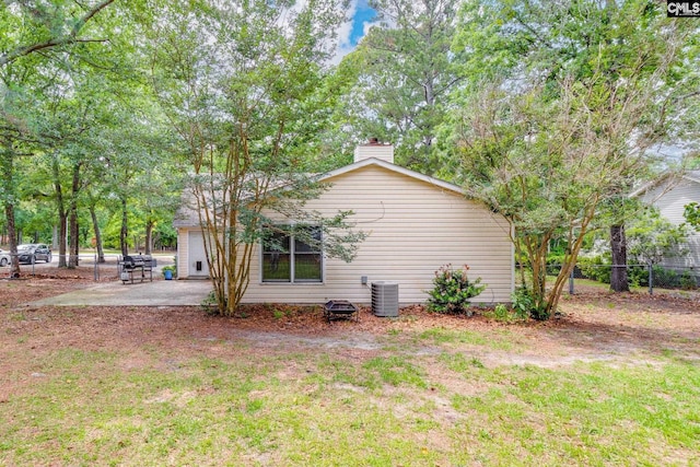 251 Kyzer Rd, Lexington, SC 29073 - view of property exterior featuring a chimney, a patio, and central AC unit