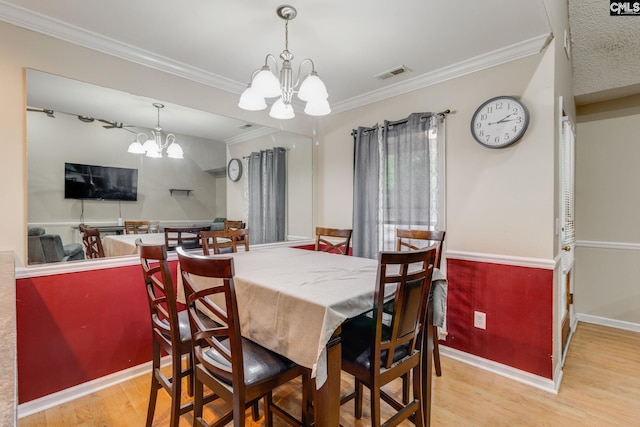 251 Kyzer Rd, Lexington, SC 29073 - dining room featuring a chandelier, wood finished floors, crown molding, and baseboards